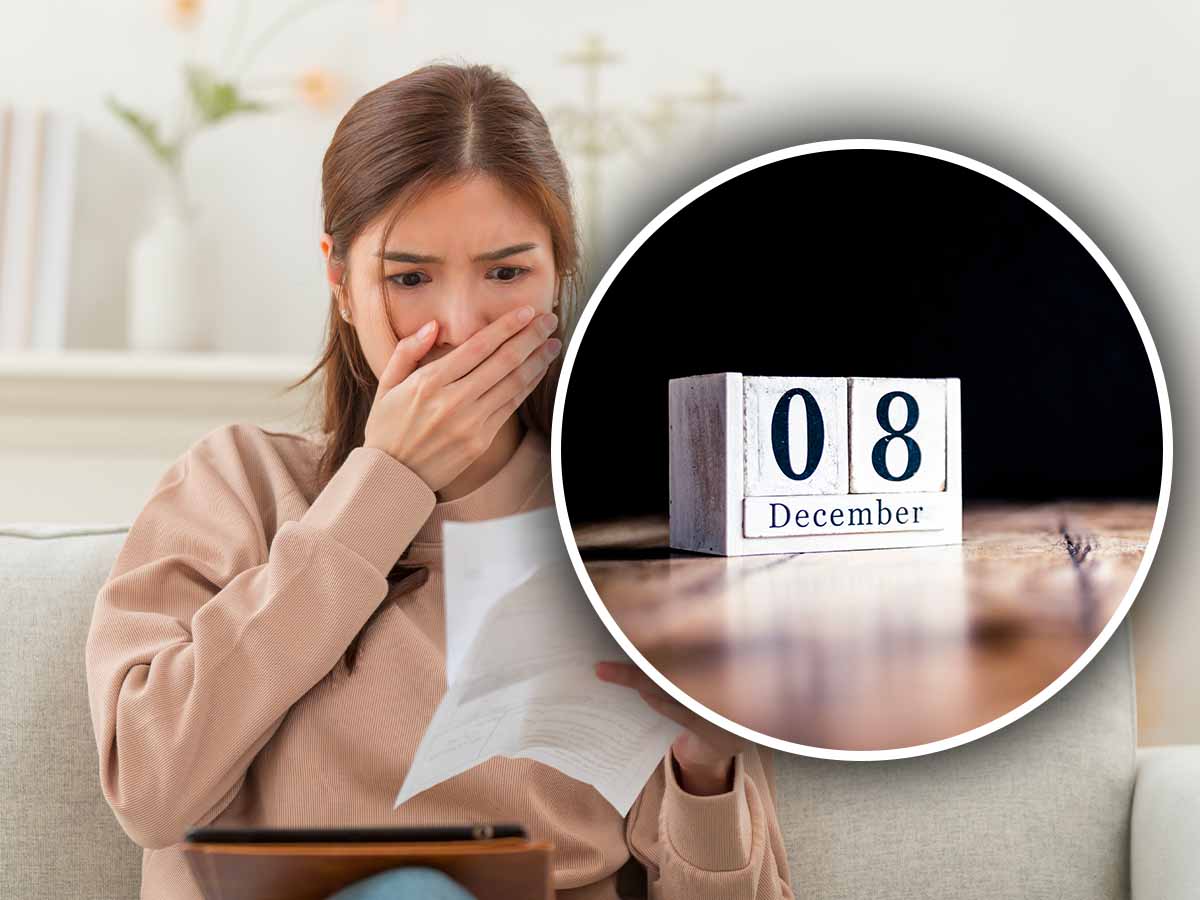 una donna con la mano sulla bocca e vicino un calendario