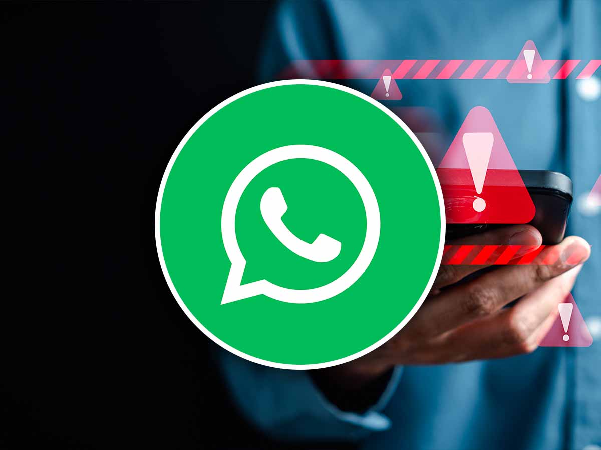 logo WhatsApp con dietro segnale di pericolo