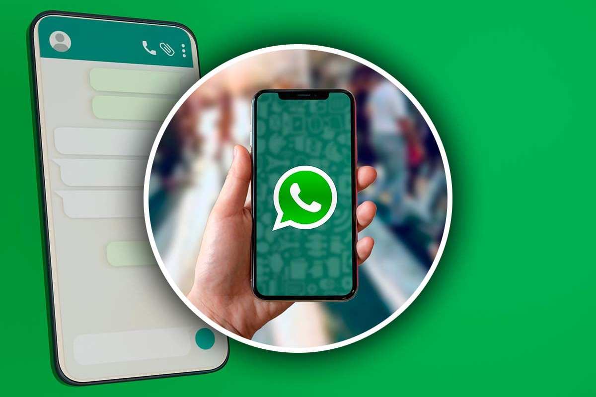 Cellulare in mano su schermata WhatsApp